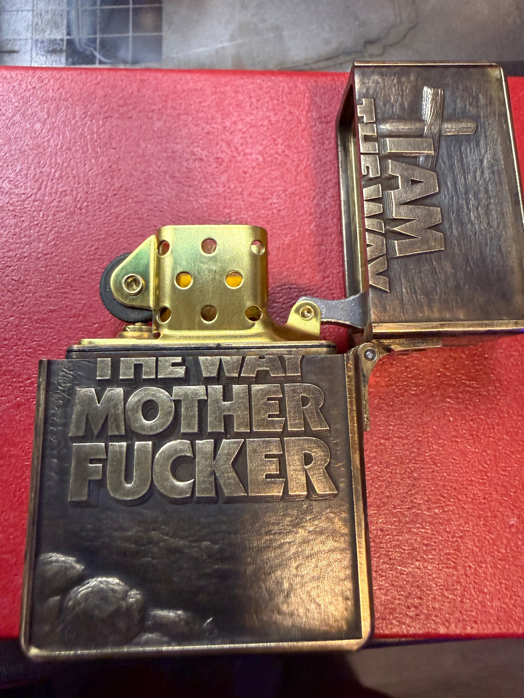 Dungeon Crawler Carl inspired Uzi Jesus, heavy duty Zoro 915 lighter