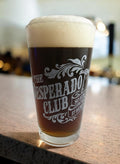 Desperado Club Pint Glass – Dungeon Crawler Carl inspired artwork